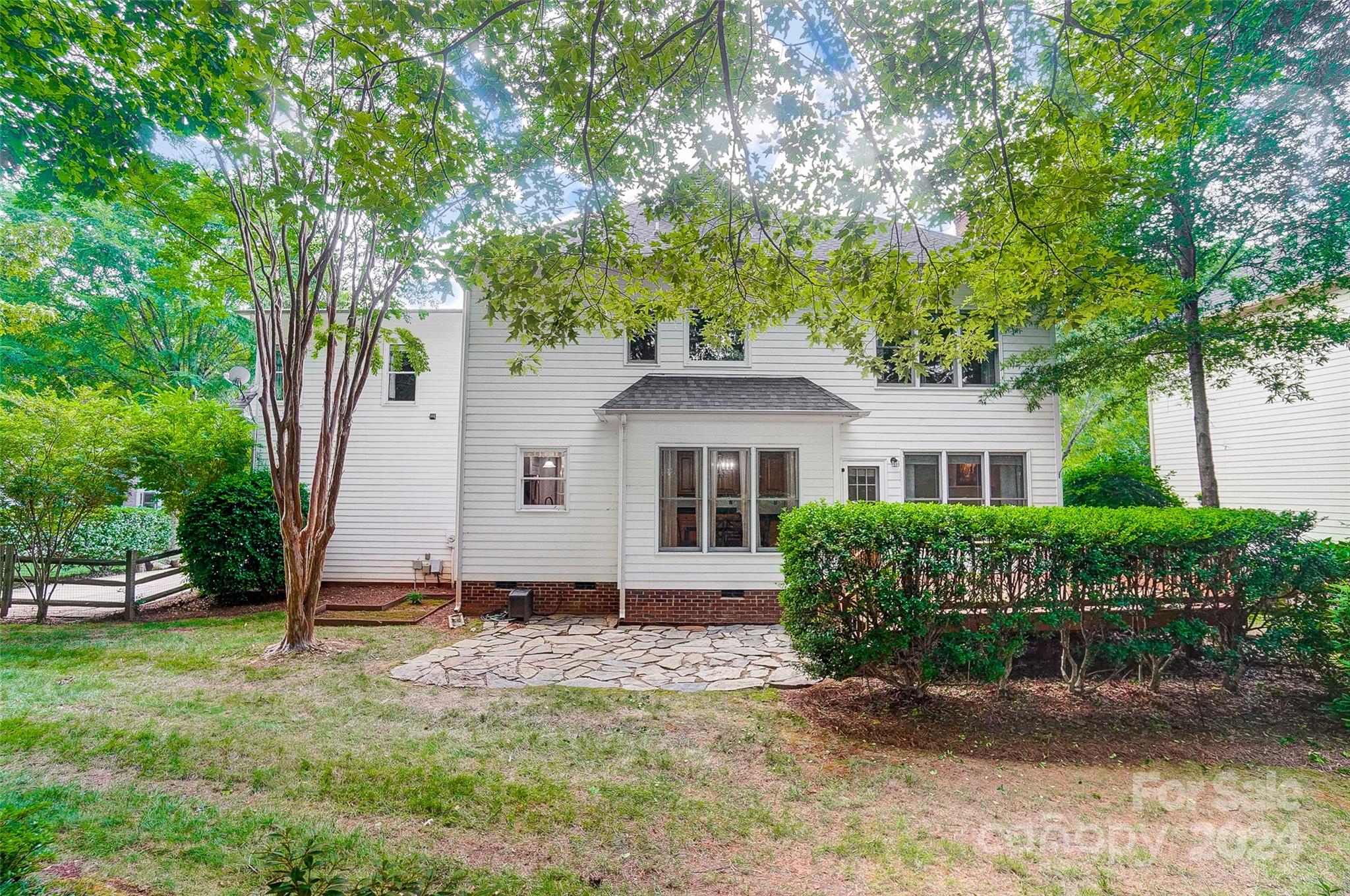 15110 MacBeth Court Huntersville, NC 28078 - Photo 26 of 36 a front view of a house with a garden