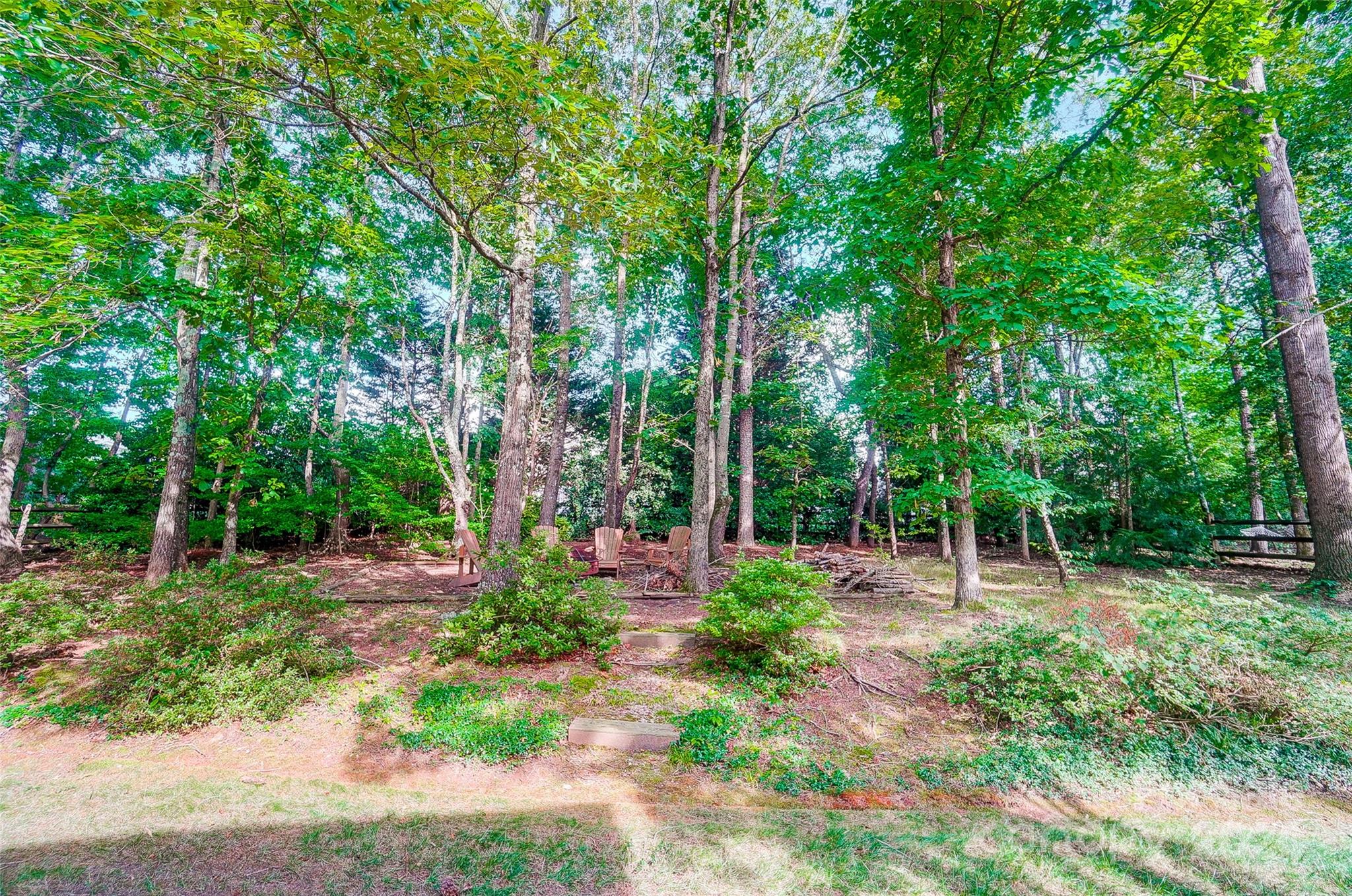 15110 MacBeth Court Huntersville, NC 28078 - Photo 5 of 36 a childrens park with lots of trees