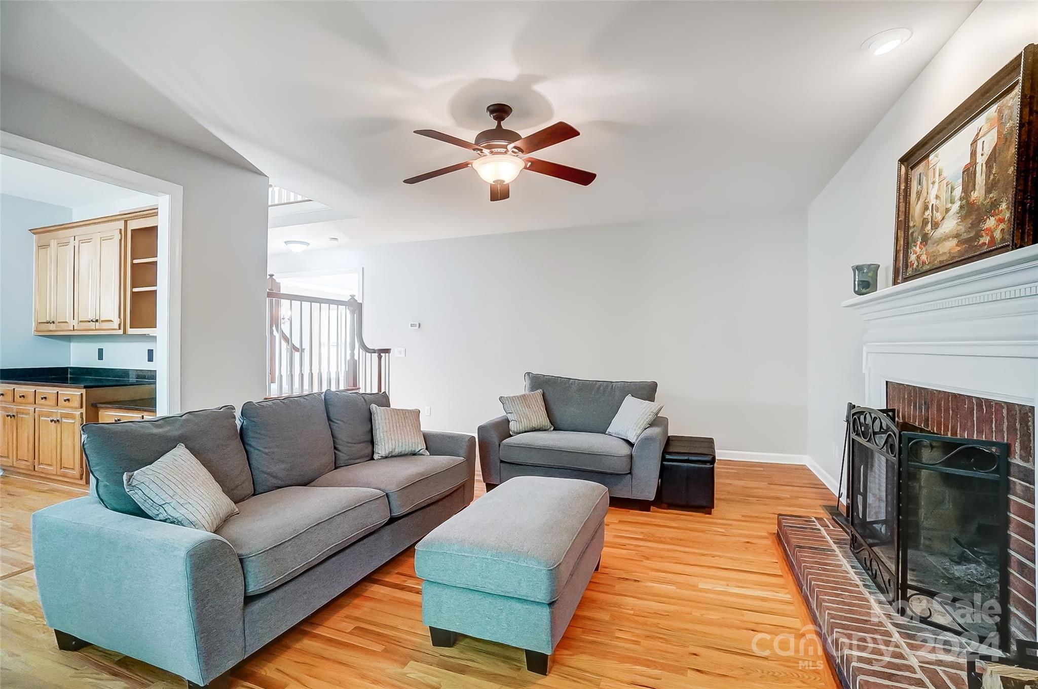 15110 MacBeth Court Huntersville, NC 28078 - Photo 7 of 36 a living room with furniture and a fireplace