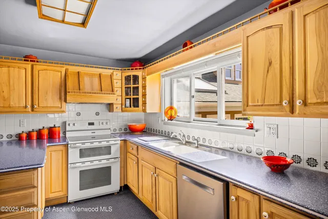 a living room with furniture gym equipment and a rug