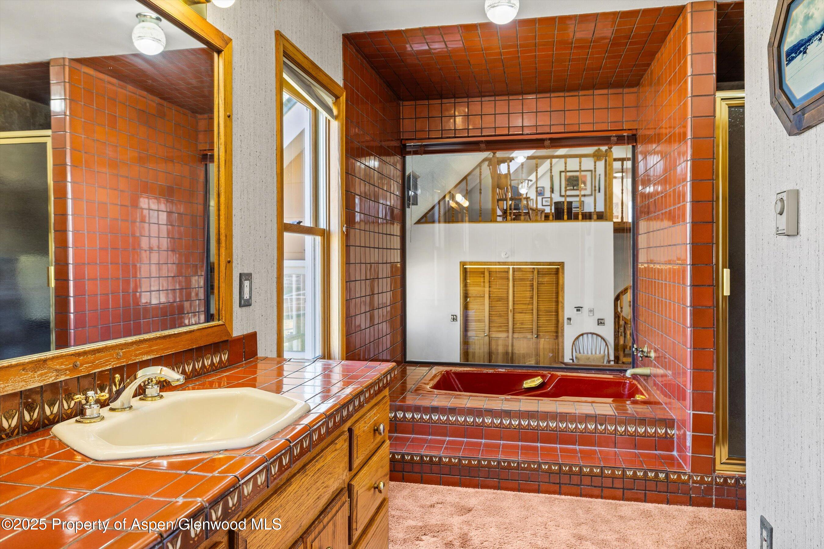 7781 County Road 320 Rifle, CO 81650 - Photo 34 of 63 a bathroom with a tub and a sink