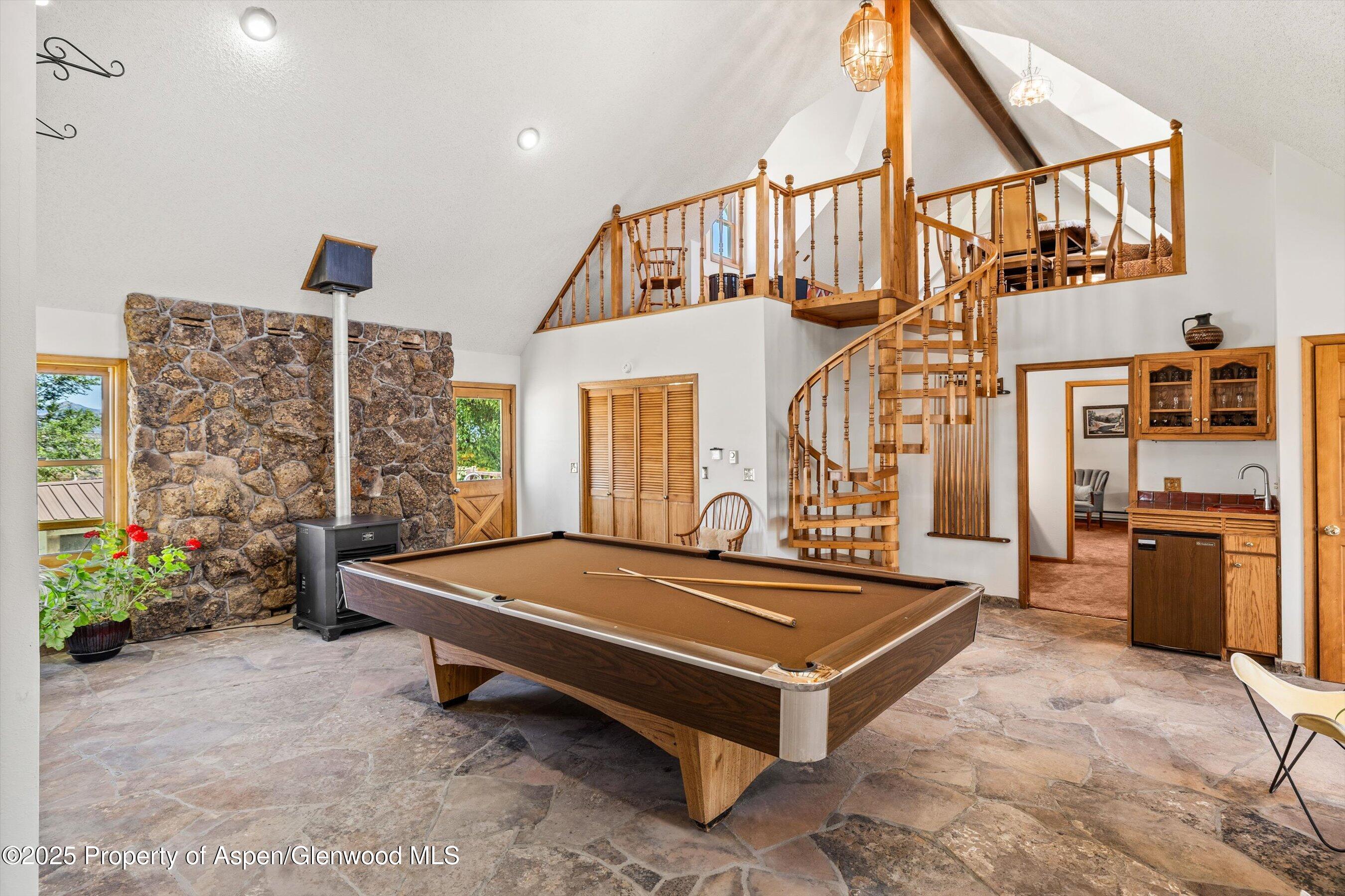 7781 County Road 320 Rifle, CO 81650 - Photo 37 of 63 a room with pool table and windows