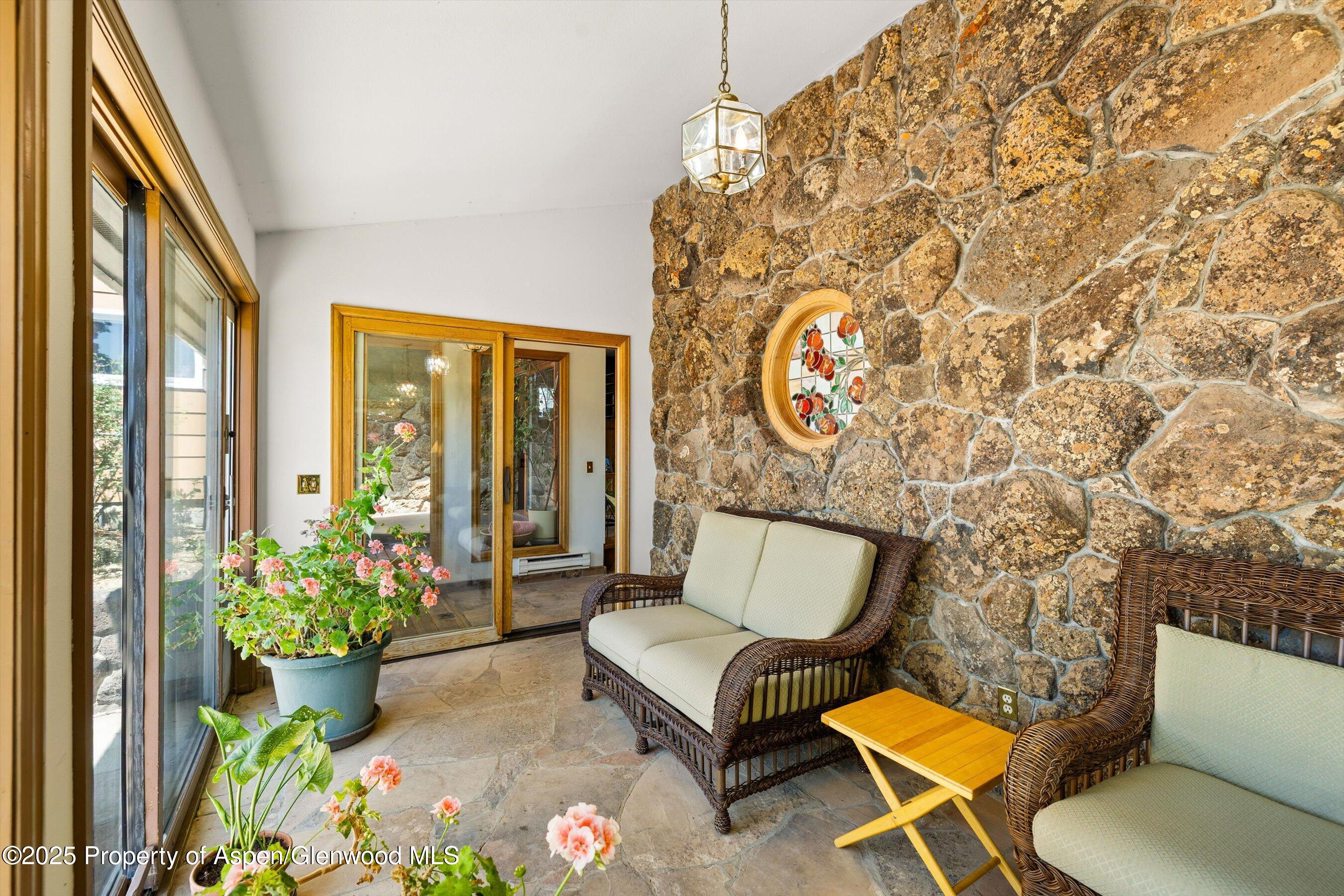 7781 County Road 320 Rifle, CO 81650 - Photo 39 of 63 a living room with a couch and a potted plant