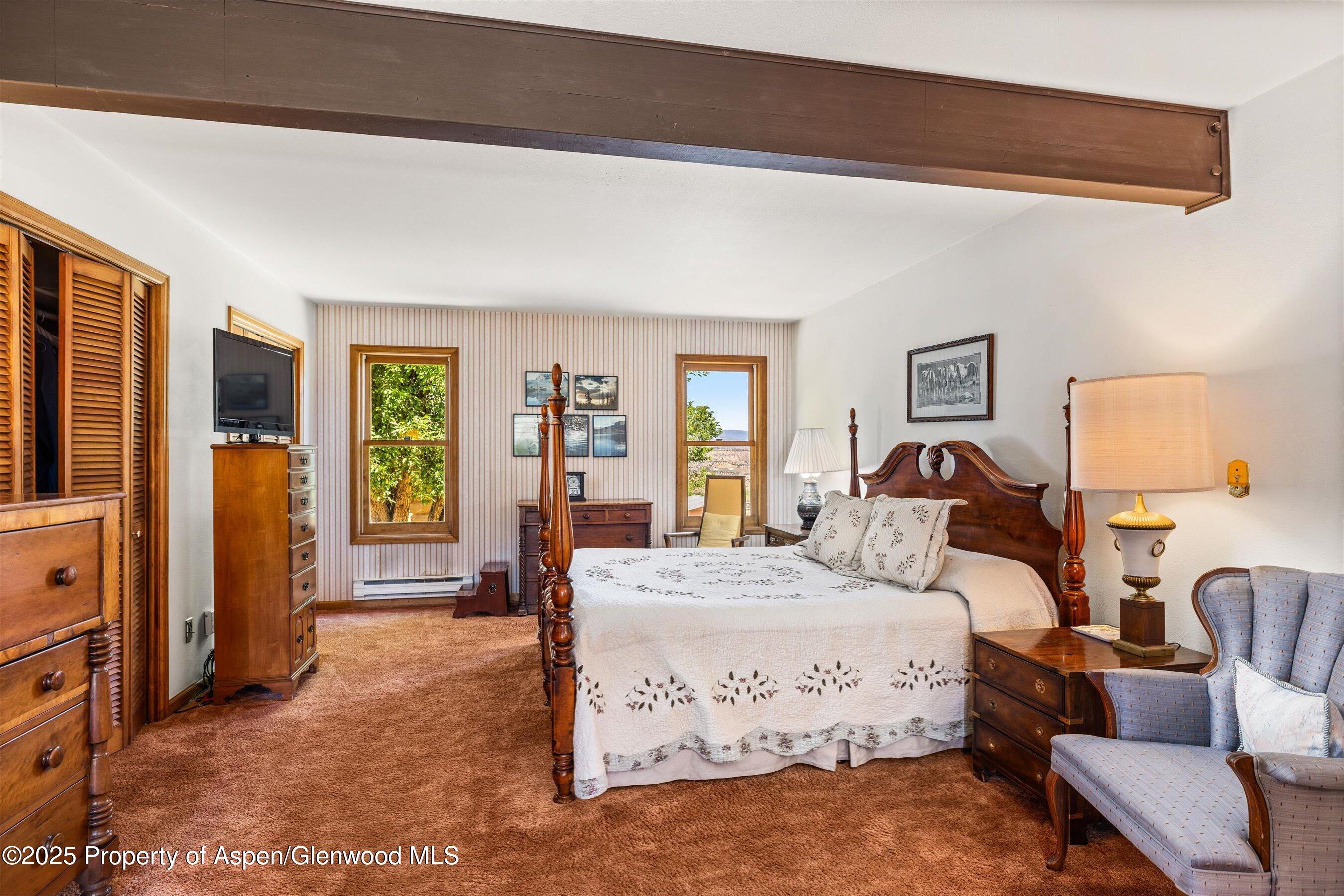 7781 County Road 320 Rifle, CO 81650 - Photo 41 of 63 a bedroom with bed and window