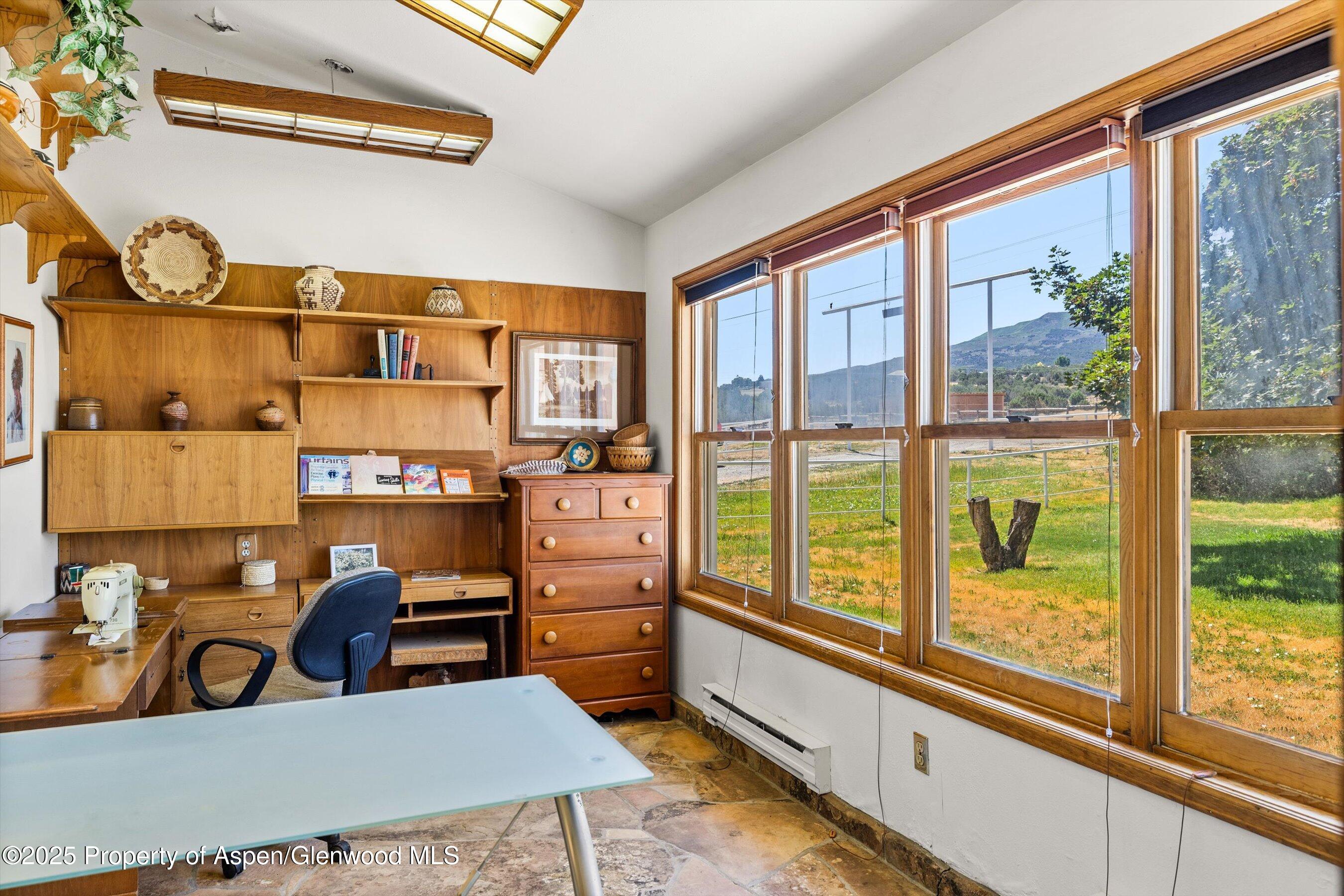 7781 County Road 320 Rifle, CO 81650 - Photo 45 of 63 a view of a dining room with furniture window and outside view