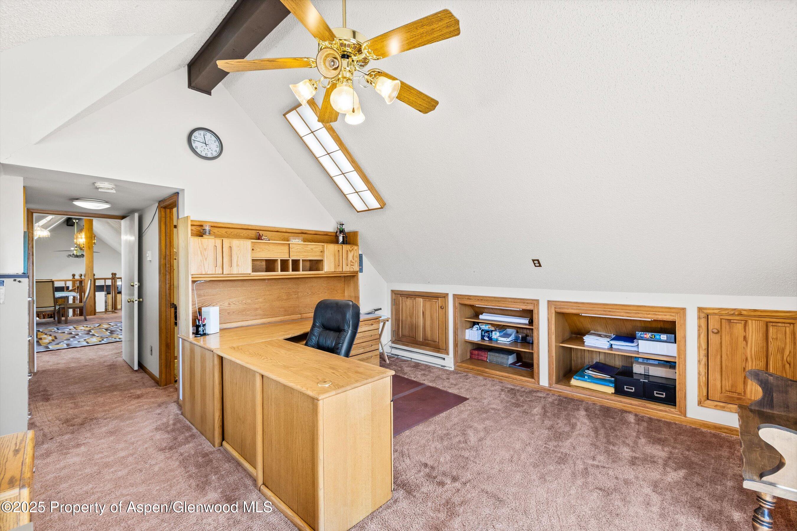 7781 County Road 320 Rifle, CO 81650 - Photo 49 of 63 a living room with furniture and a flat screen tv