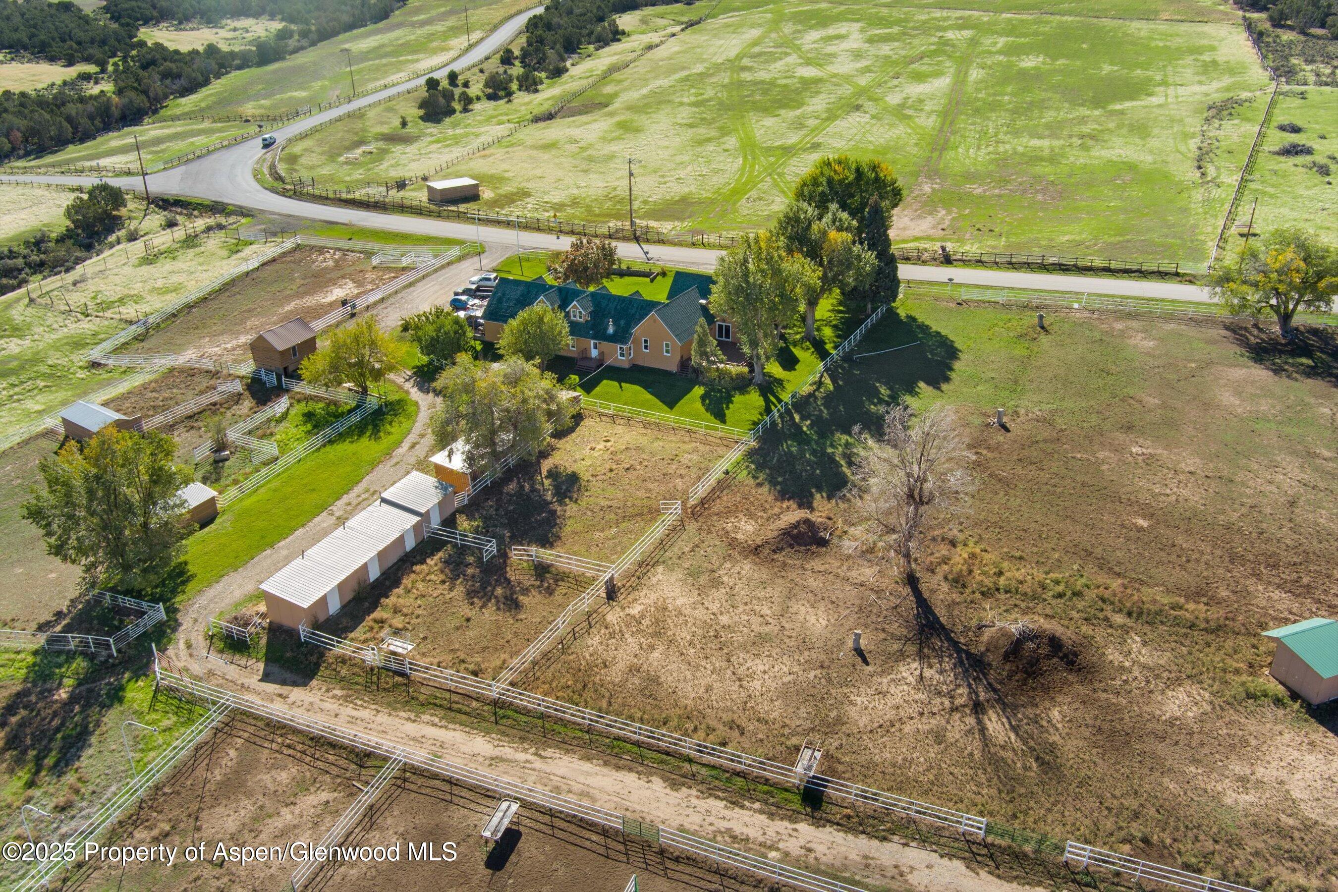 7781 County Road 320 Rifle, CO 81650 - Photo 62 of 63 a view of a yard with an outdoor space
