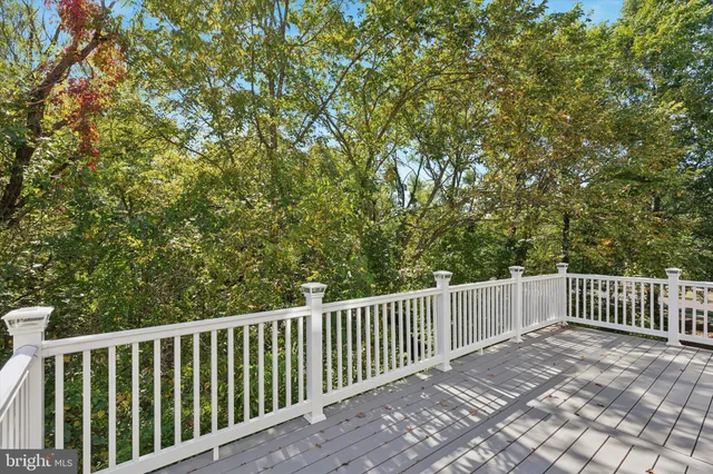 a view of a roof deck with wooden fence