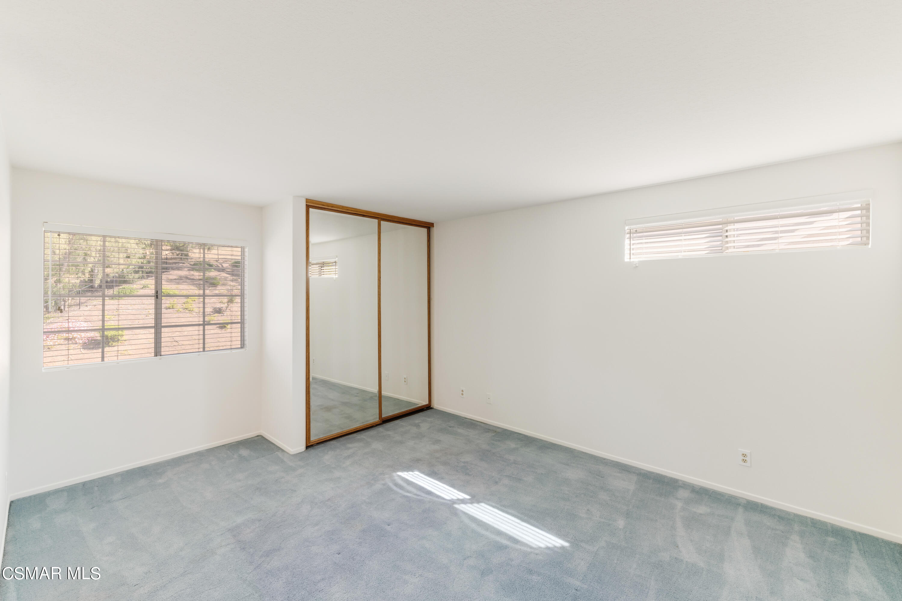 11661 Chestnut Ridge Street Moorpark, CA 93021 - Photo 21 of 39 an empty room with windows and closet