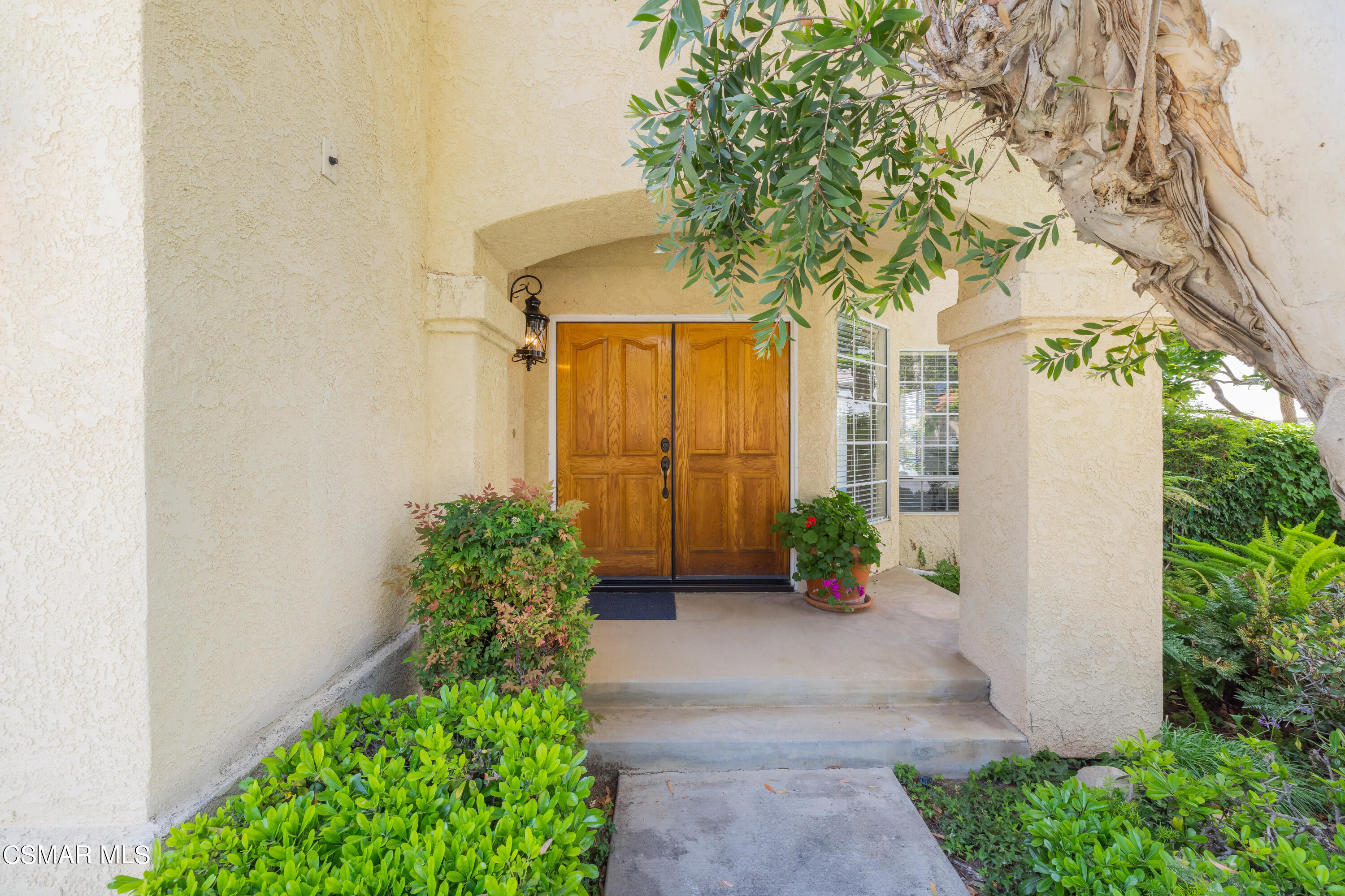 11661 Chestnut Ridge Street Moorpark, CA 93021 - Photo 3 of 39 a front view of a house with a yard
