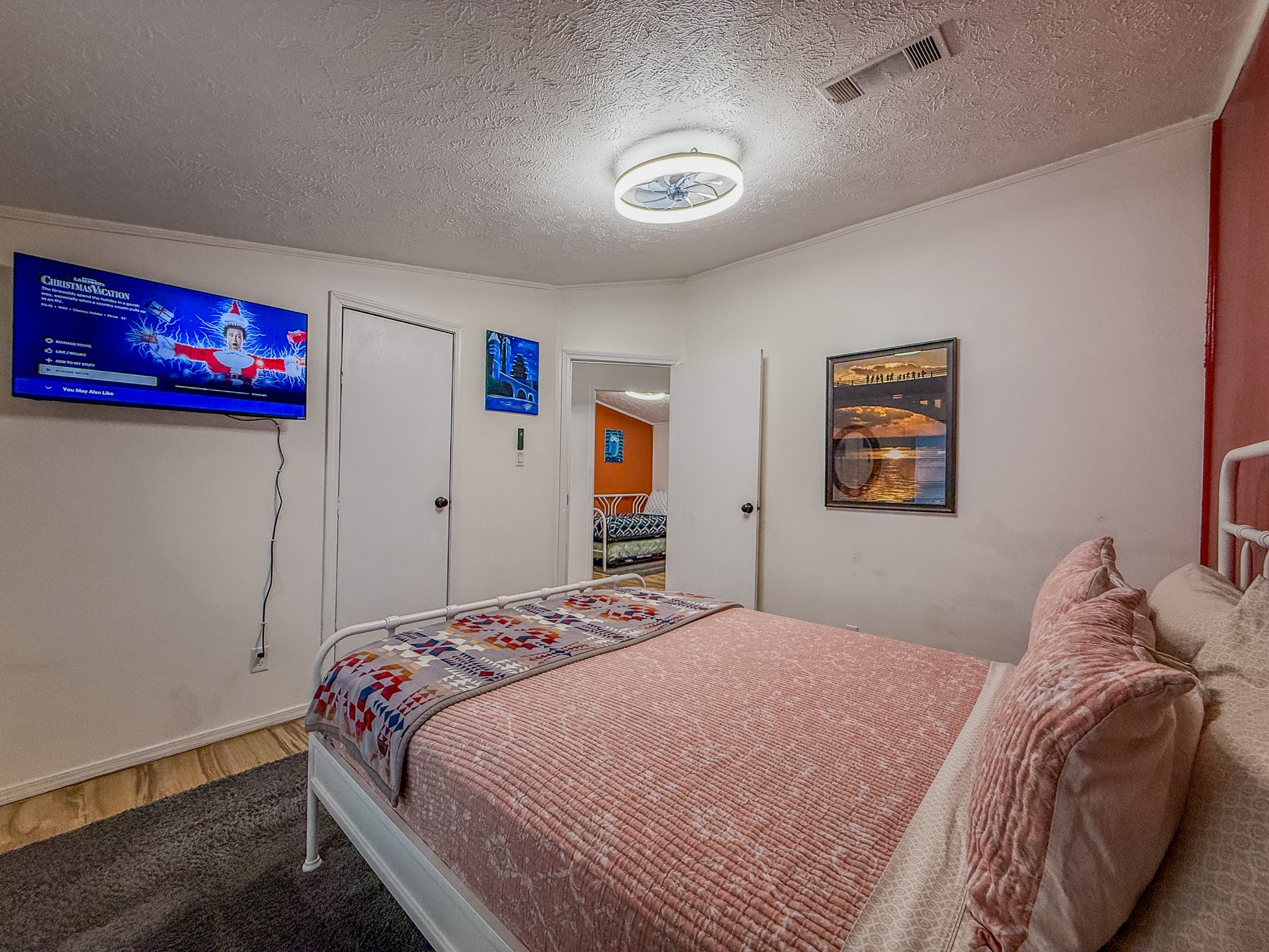 2015 Holly Street Austin, TX 78702 - Photo 11 of 24 Relax in this well-lit bedroom featuring wood flooring and a refreshing ceiling fan.