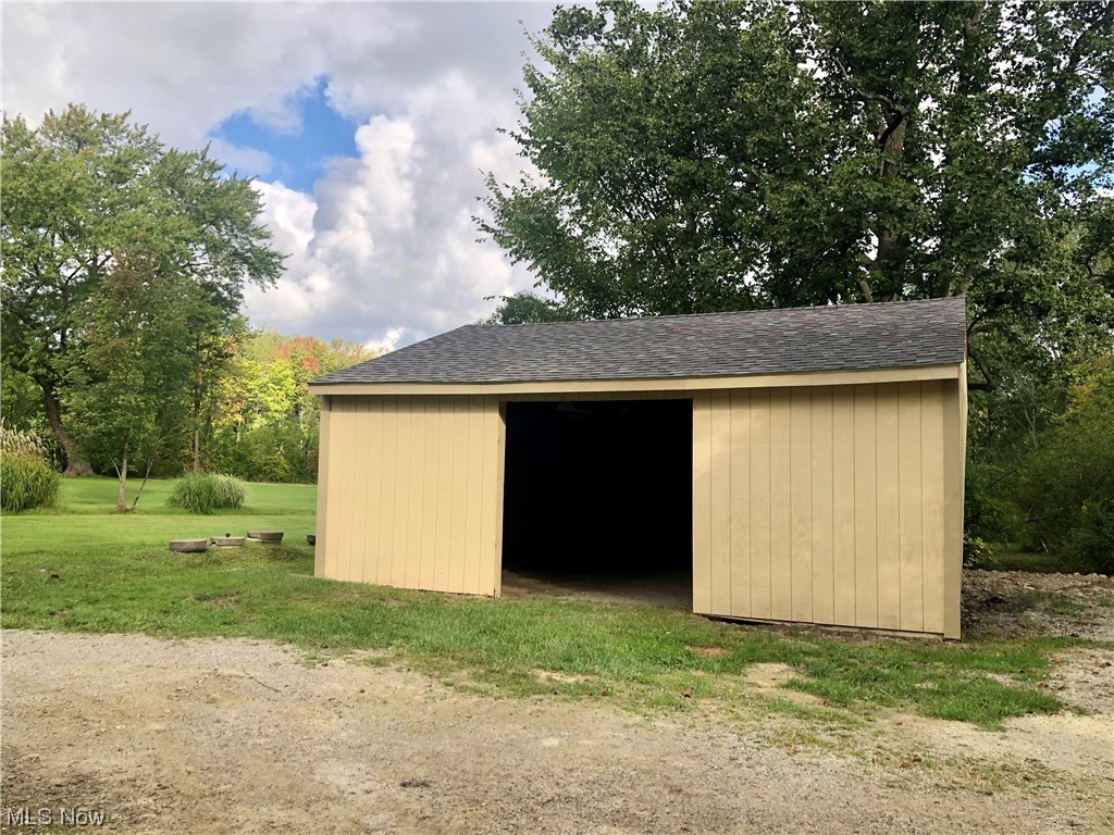 12071 Girdled Road Painesville, OH 44077 - Photo 13 of 15 View of shed / structure with an outdoor structure and a yard