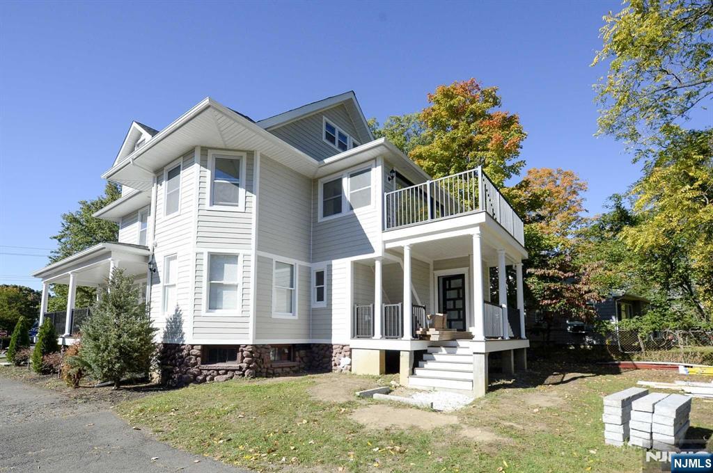 56 Myrtle Avenue, Unit 2 Allendale, NJ 07401 - Photo 15 of 15 a front view of a house with a yard