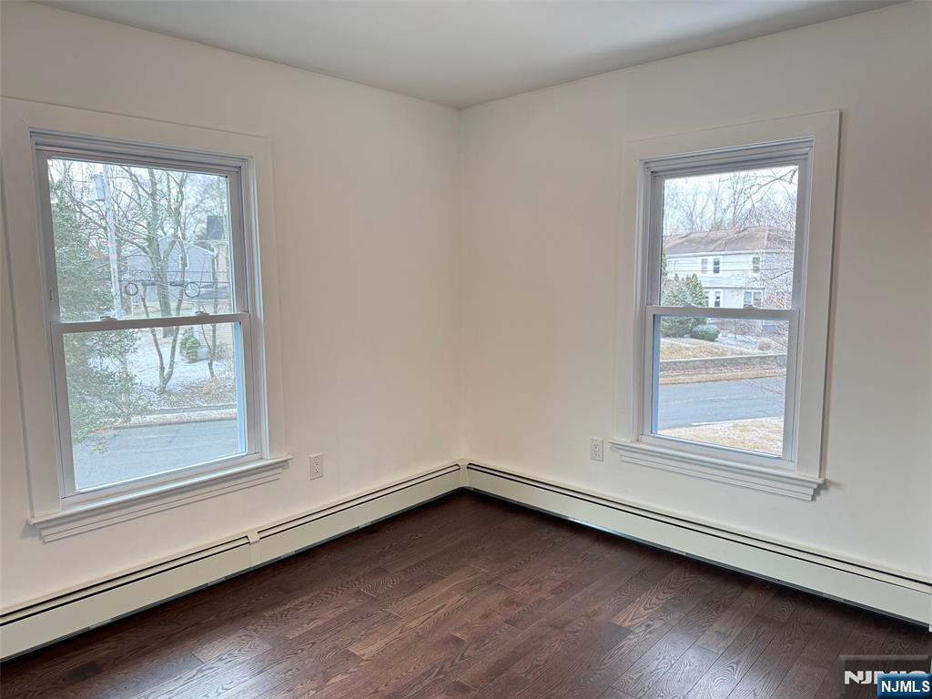 56 Myrtle Avenue, Unit 2 Allendale, NJ 07401 - Photo 10 of 15 an empty room with wooden floor and windows