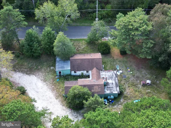 an aerial view of a house with outdoor space and street view