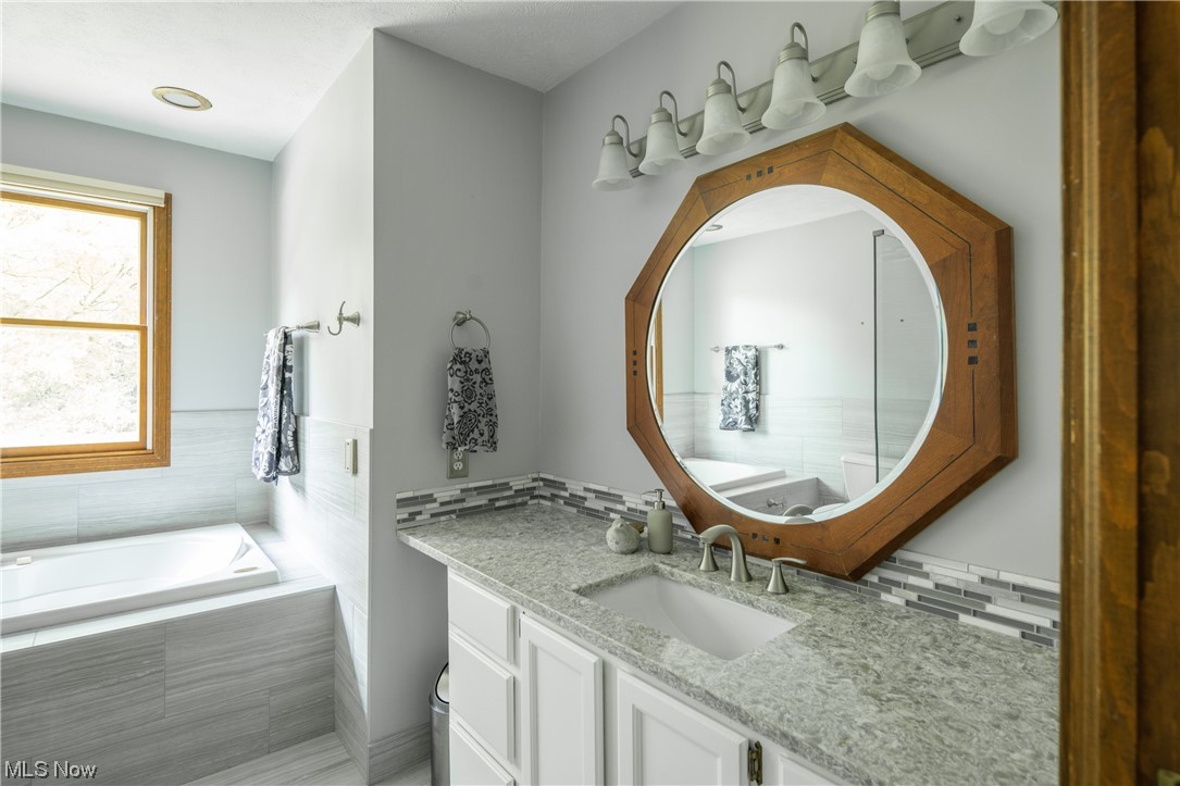 868 Trebisky Road Cleveland, OH 44121 - Photo 18 of 35 Master Bathroom with a vanity and mirror
