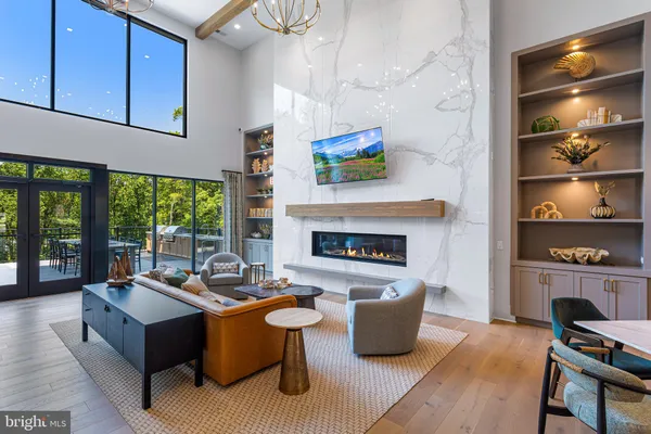a living room with furniture fireplace and flat screen tv