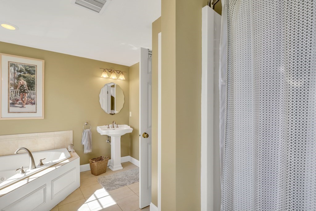 359 Service Road East Sandwich, MA 02537 - Photo 25 of 36 a bathroom with a toilet sink and mirror