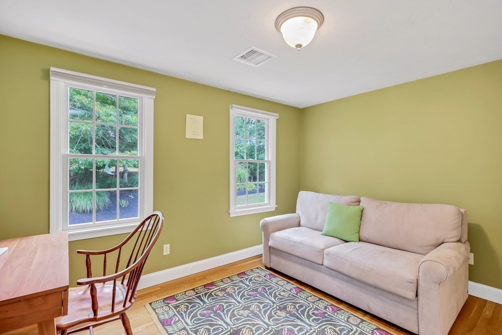 359 Service Road East Sandwich, MA 02537 - Photo 28 of 36 a living room with furniture and a window