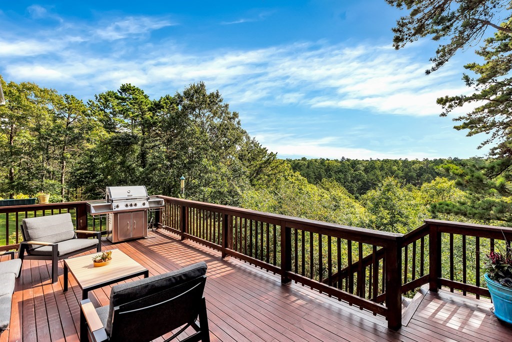 359 Service Road East Sandwich, MA 02537 - Photo 32 of 36 a view of a balcony with wooden floor and outdoor seating
