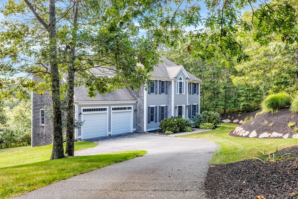 359 Service Road East Sandwich, MA 02537 - Photo 36 of 36 a front view of a house with a garden and yard