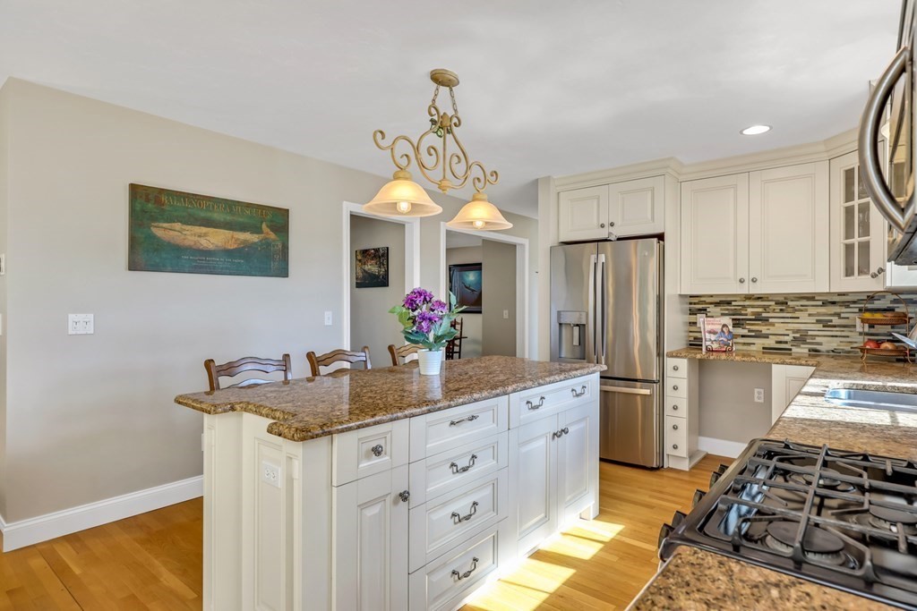 359 Service Road East Sandwich, MA 02537 - Photo 5 of 36 a kitchen with stainless steel appliances granite countertop a sink stove and refrigerator
