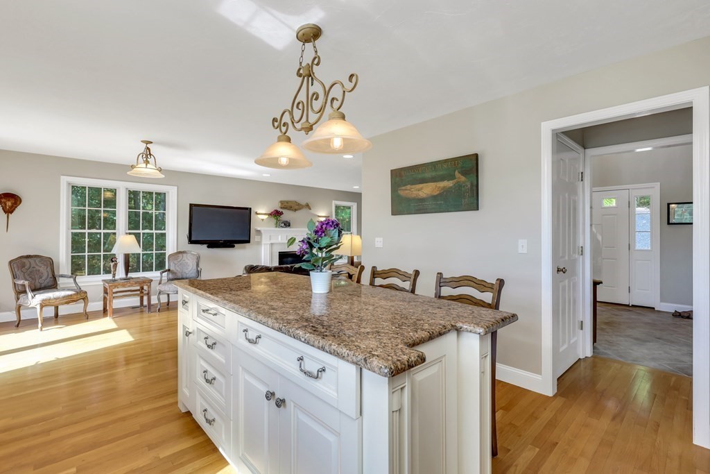 359 Service Road East Sandwich, MA 02537 - Photo 6 of 36 a kitchen with stainless steel appliances granite countertop a sink and a refrigerator