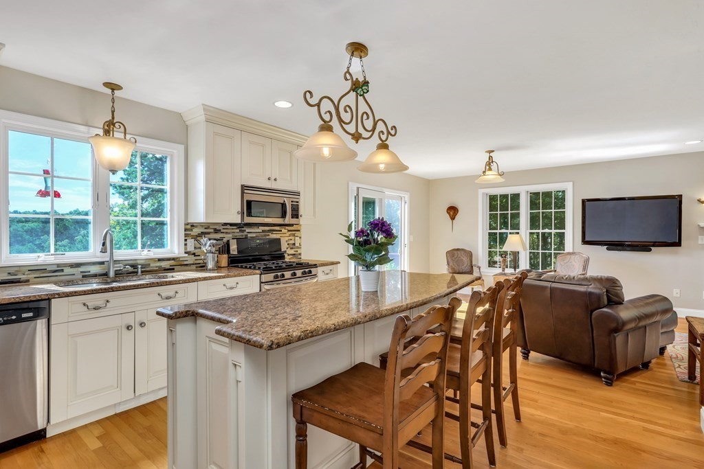 359 Service Road East Sandwich, MA 02537 - Photo 7 of 36 a kitchen with granite countertop lots of counter top space and living room