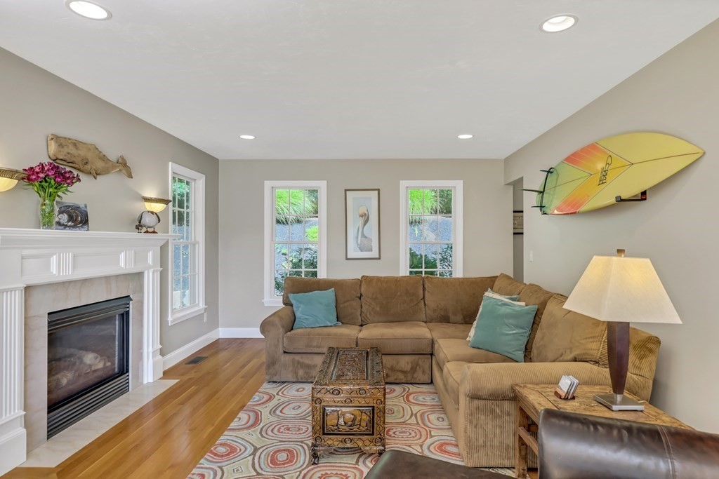 359 Service Road East Sandwich, MA 02537 - Photo 10 of 36 a living room with furniture and a fireplace