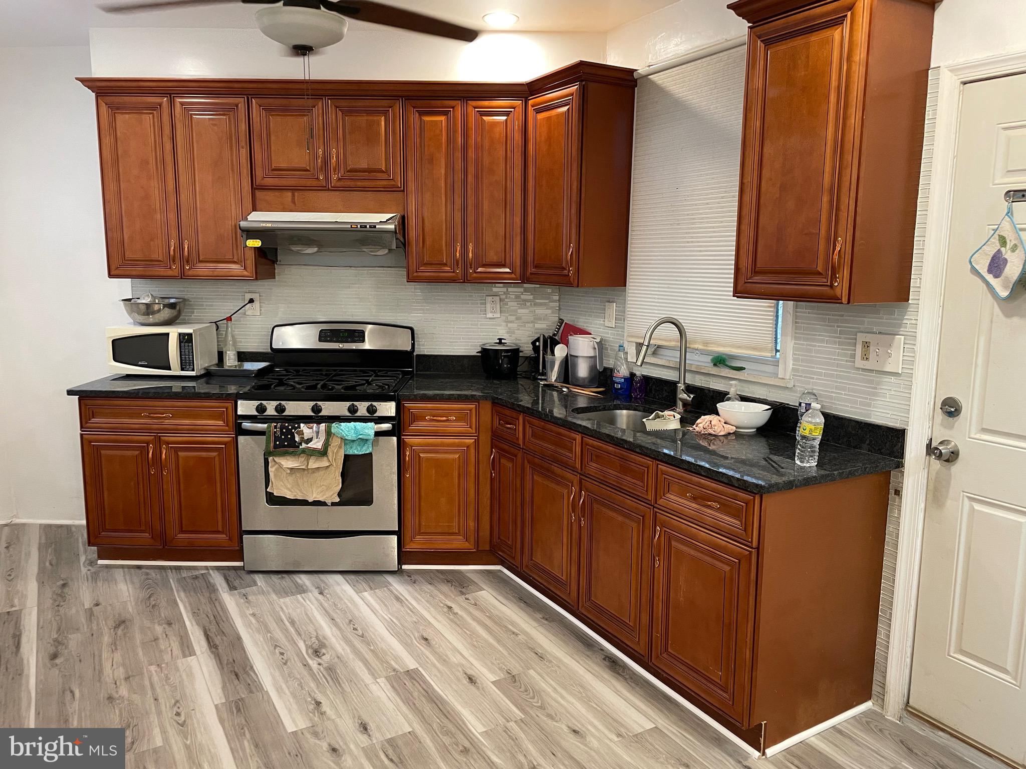 813 Federal Street Philadelphia, PA 19147 - Photo 1 of 28 a kitchen with stainless steel appliances granite countertop a sink a stove and cabinets