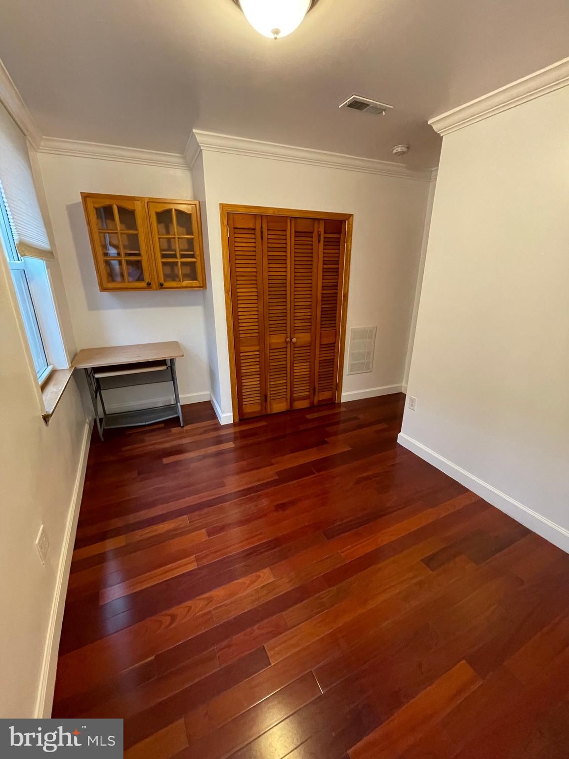 813 Federal Street Philadelphia, PA 19147 - Photo 19 of 28 a view of an empty room with wooden floor and a window