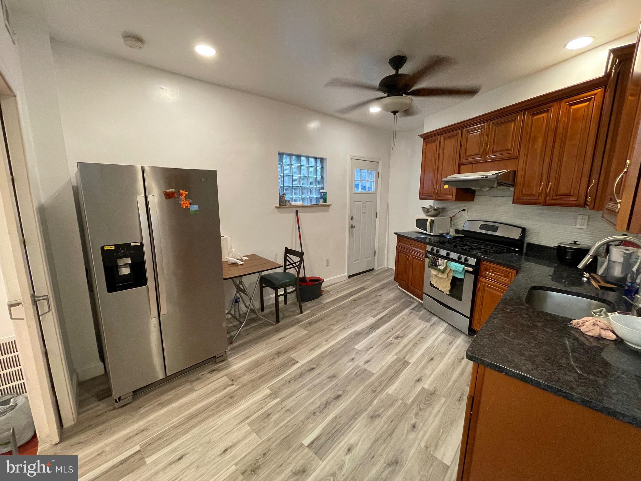 813 Federal Street Philadelphia, PA 19147 - Photo 2 of 28 a kitchen with stainless steel appliances granite countertop a refrigerator stove and sink