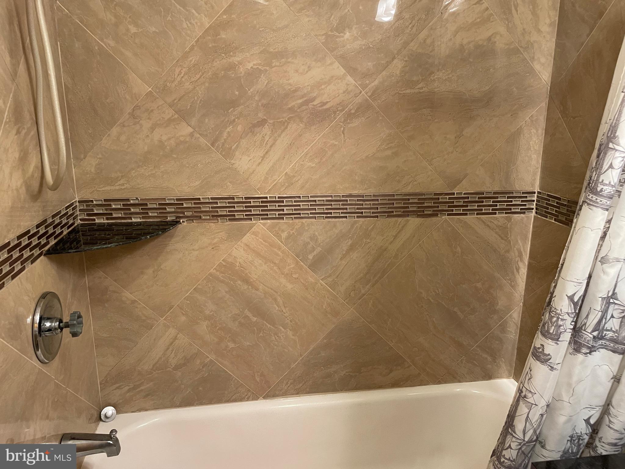 813 Federal Street Philadelphia, PA 19147 - Photo 21 of 28 a bathroom with a shower and a tub