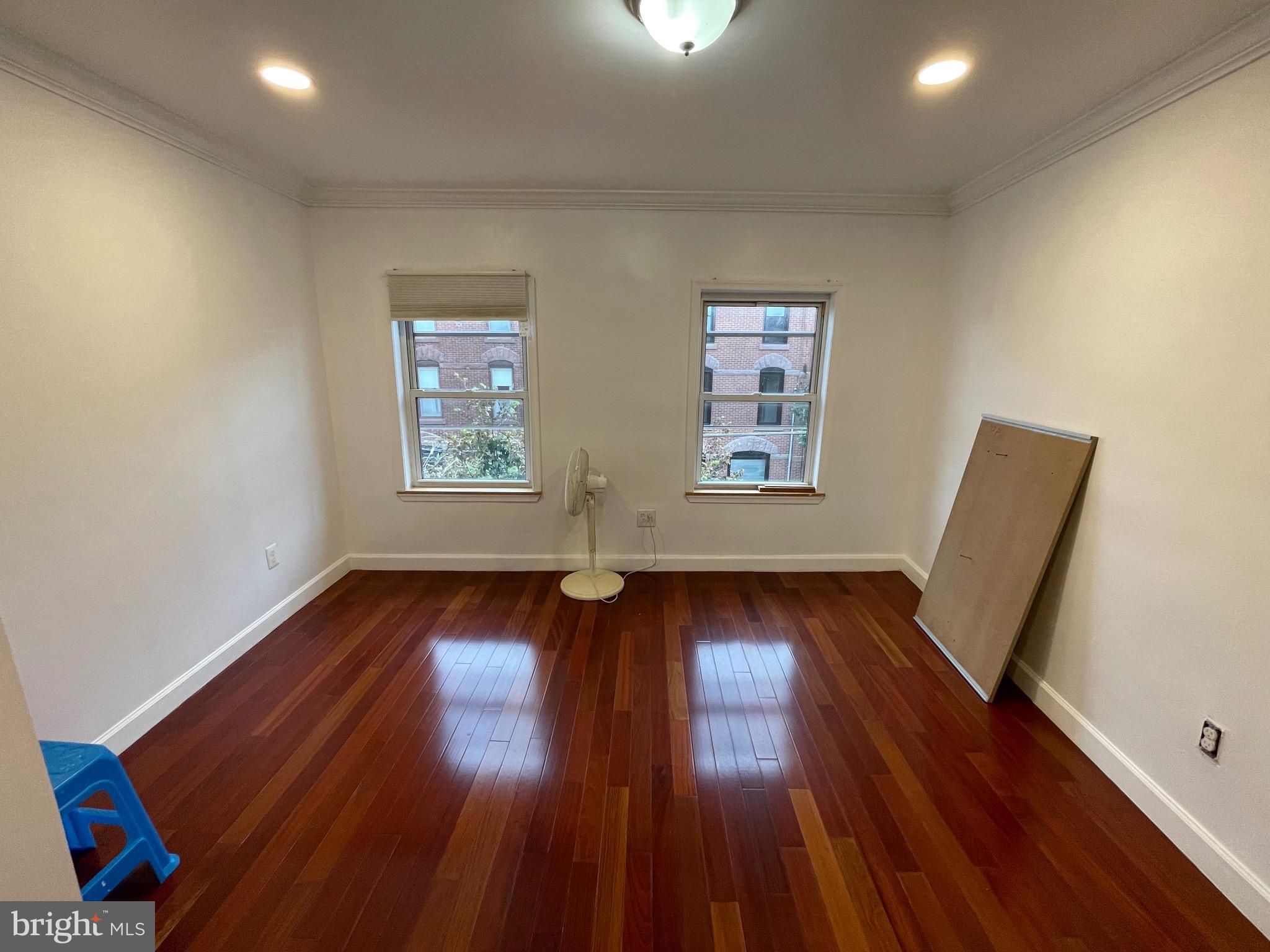 813 Federal Street Philadelphia, PA 19147 - Photo 8 of 28 wooden floor in an empty room with a window
