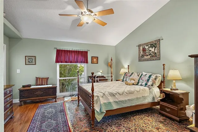 a bedroom with a bed and a couch