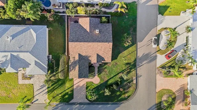 an aerial view of a house with a swimming pool