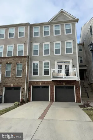 a front view of building with yard