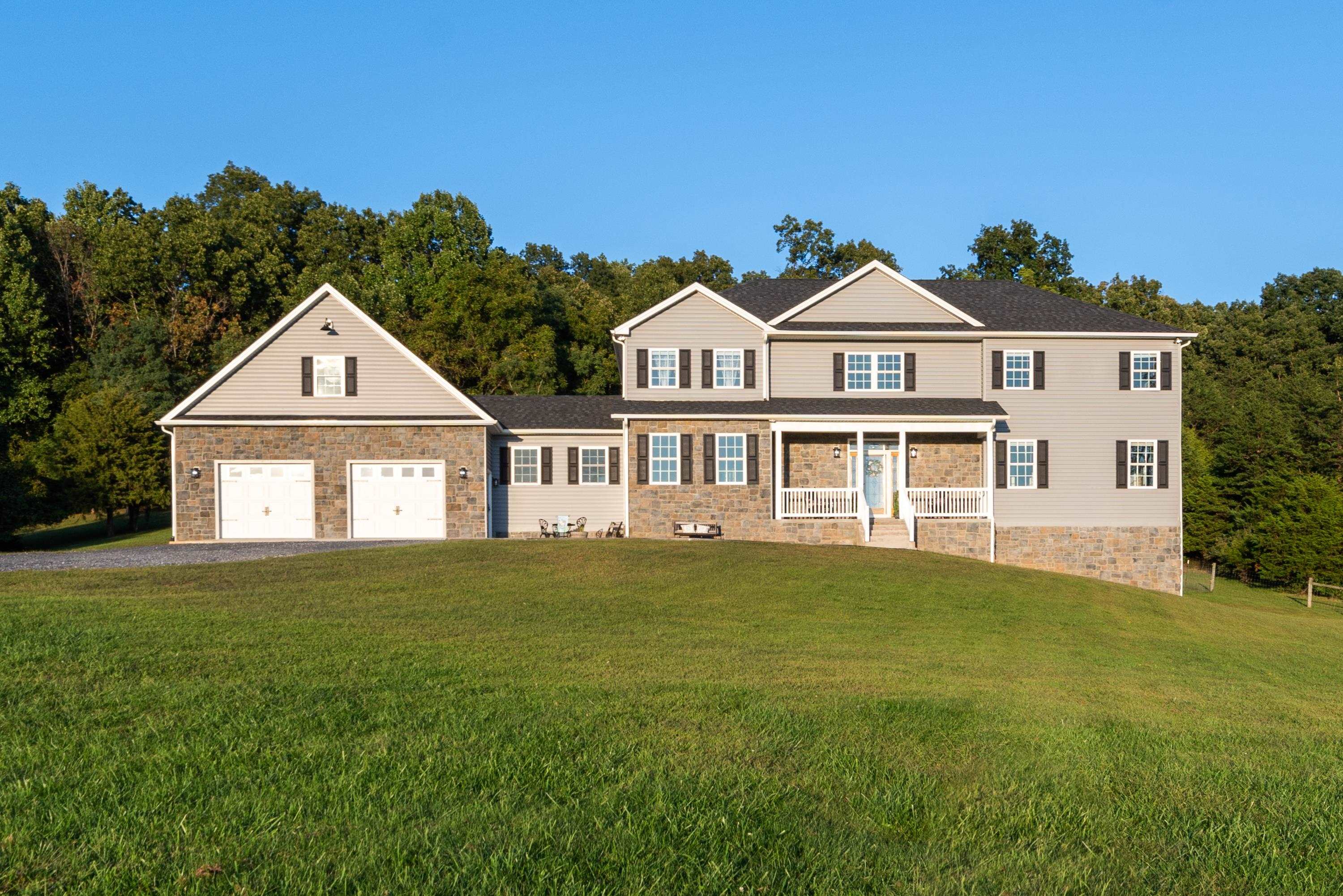 1261 Newport Road Raphine, VA 24472 - Photo 3 of 74 a front view of a house with a garden