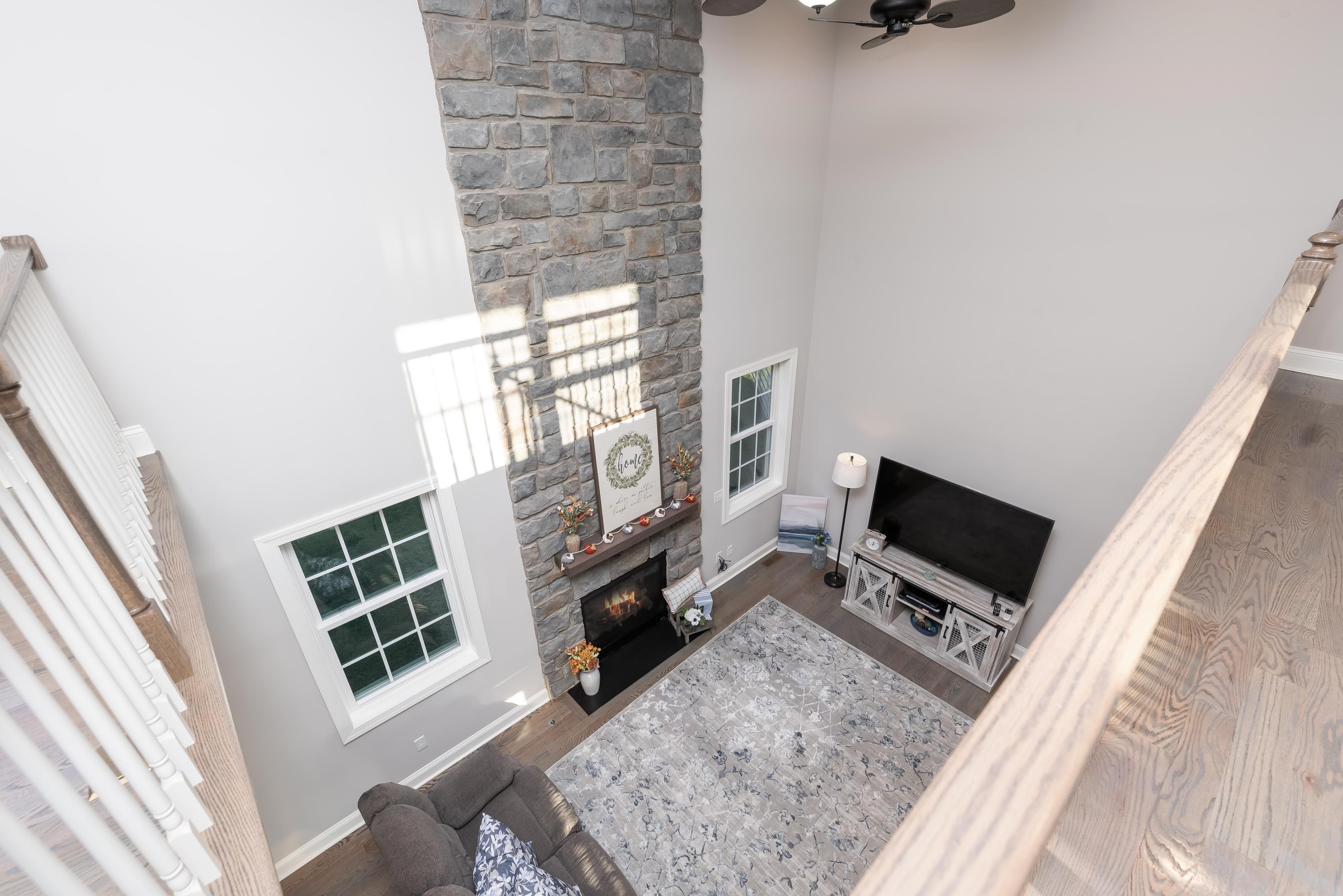 1261 Newport Road Raphine, VA 24472 - Photo 51 of 74 a living room with furniture a flat screen tv and a fireplace