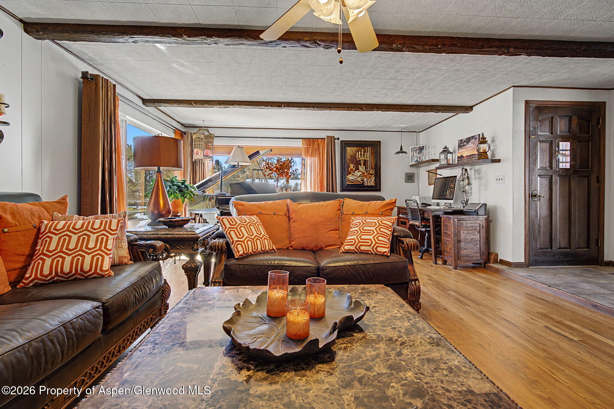 825 Cleveland Street Meeker, CO 81641 - Photo 12 of 41 a living room with furniture and a large window