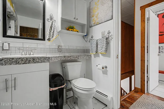 a bedroom with two beds and a large window