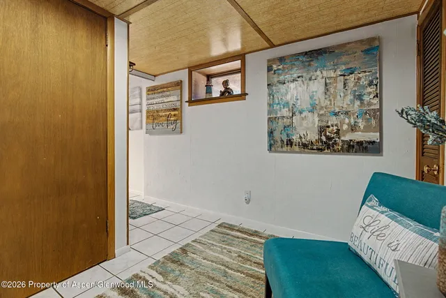 a bedroom with a bed and cabinets