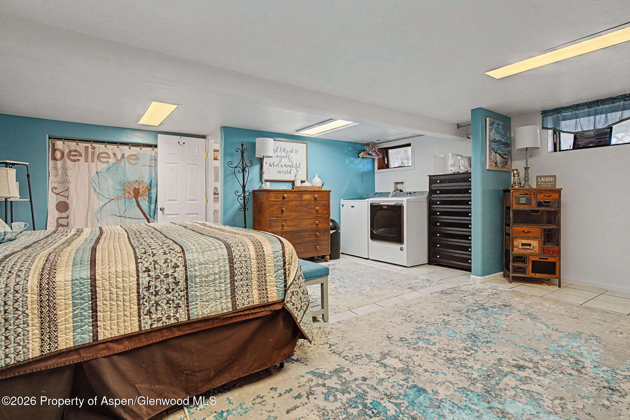 825 Cleveland Street Meeker, CO 81641 - Photo 30 of 41 a bedroom with a bed and dresser