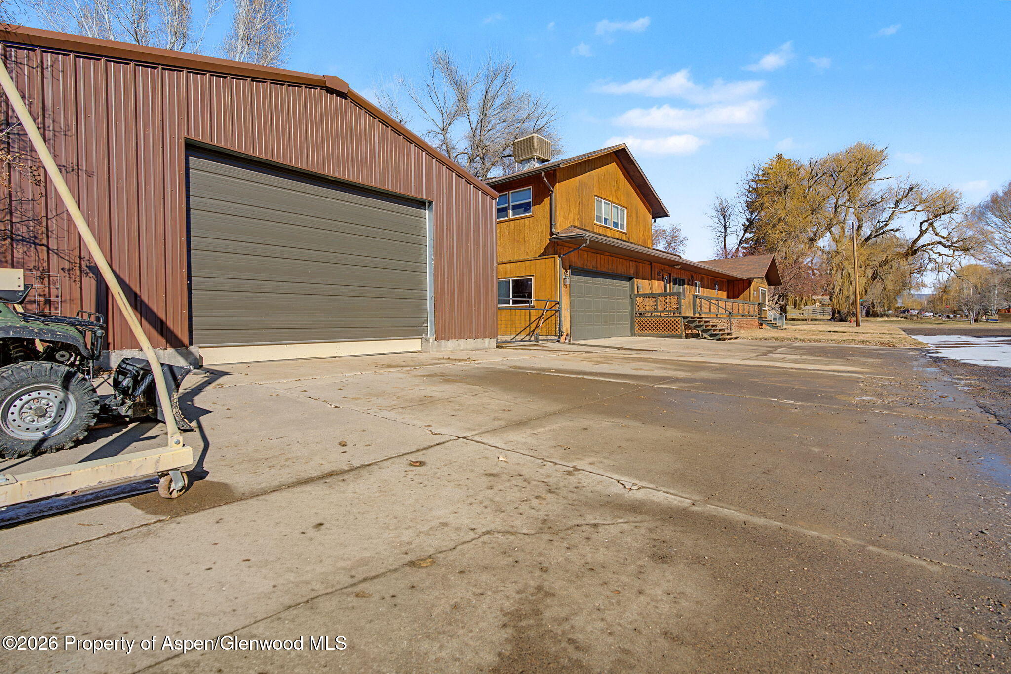 825 Cleveland Street Meeker, CO 81641 - Photo 3 of 41 a front view of a house with a garage