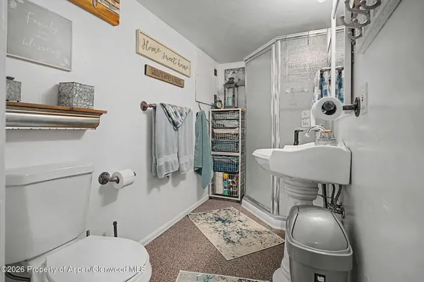 a bedroom with a bed and dresser