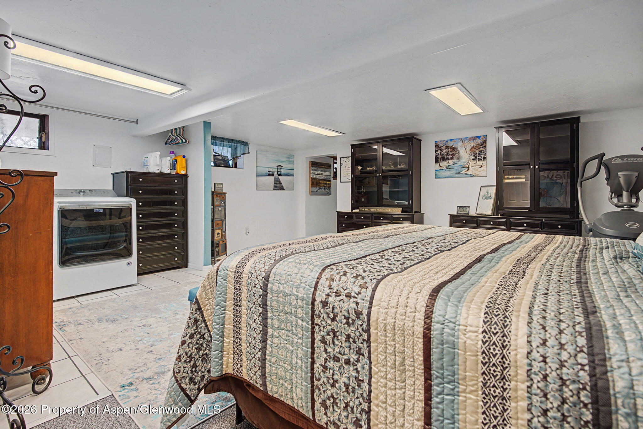 825 Cleveland Street Meeker, CO 81641 - Photo 32 of 41 a bedroom with a bed and dresser