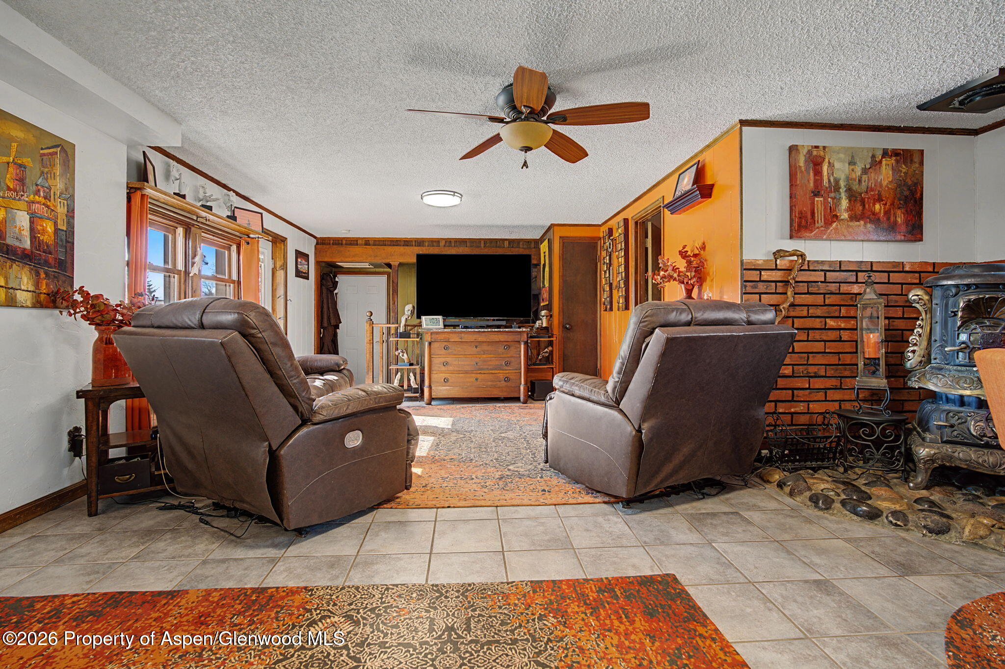 825 Cleveland Street Meeker, CO 81641 - Photo 4 of 41 a living room with furniture and a flat screen tv
