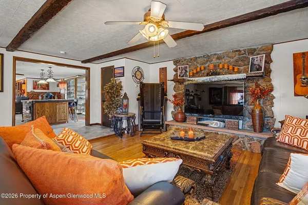 a living room with furniture a dining table and chairs