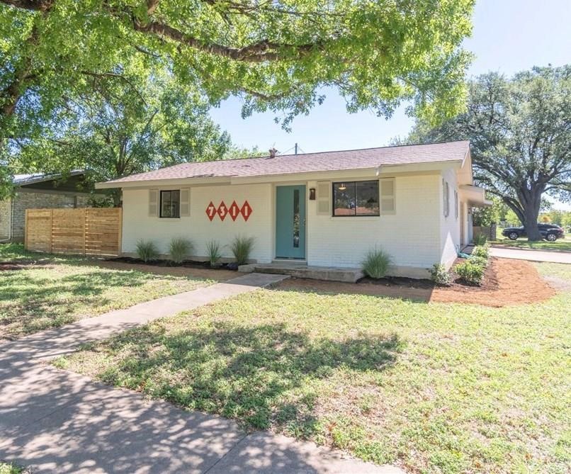 7311 Eastcrest Drive Austin, TX 78752 - Photo 1 of 1 a view of backyard of house with garage