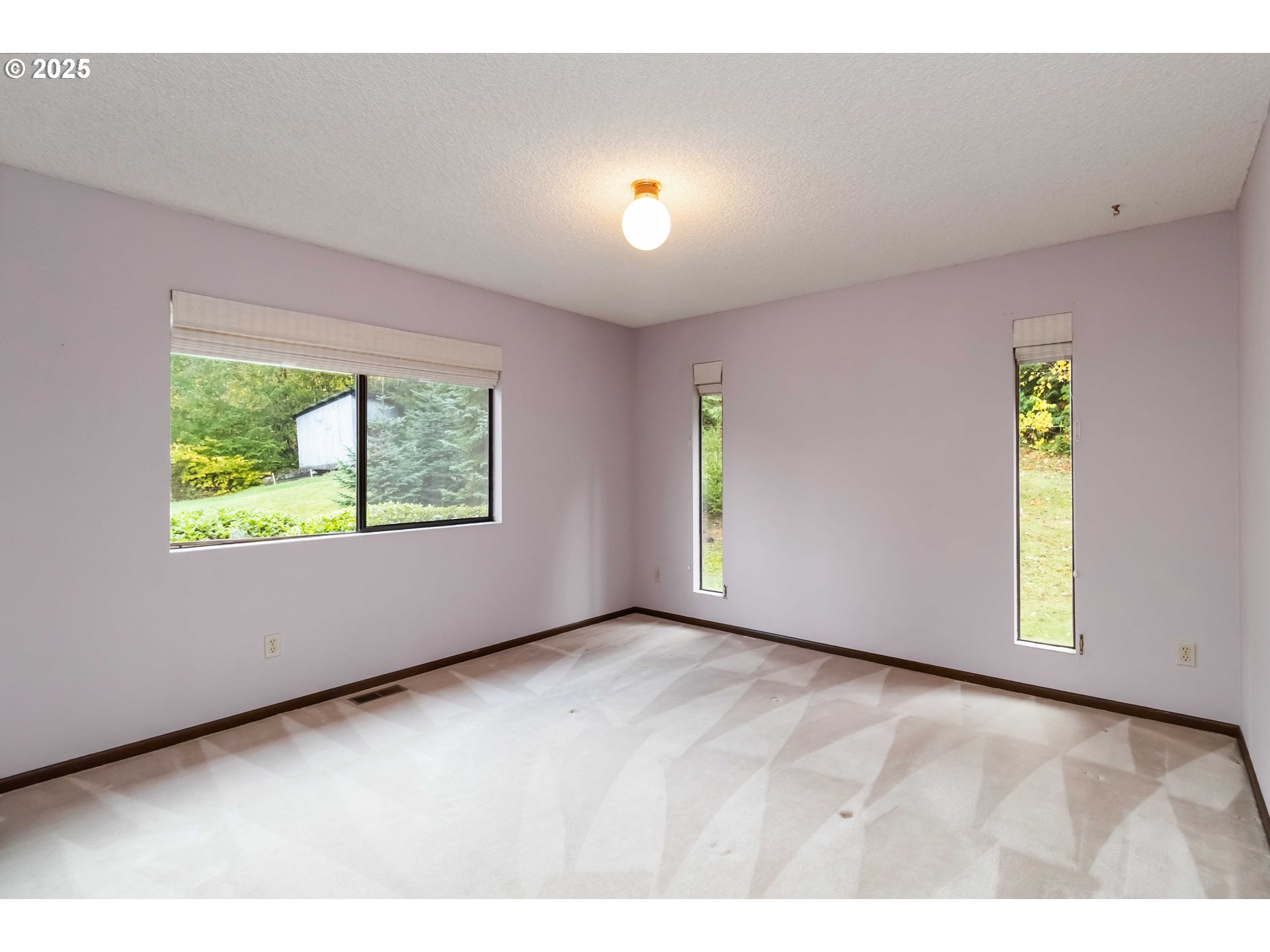 720 Abernathy Creek Road Longview, WA 98632 - Photo 18 of 44 a view of an empty room with a window